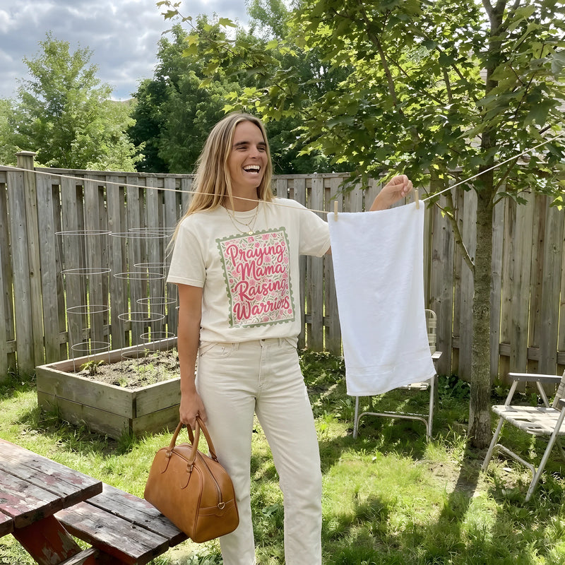 Praying Mama Raising Warriors worn by a model | Ivory model front